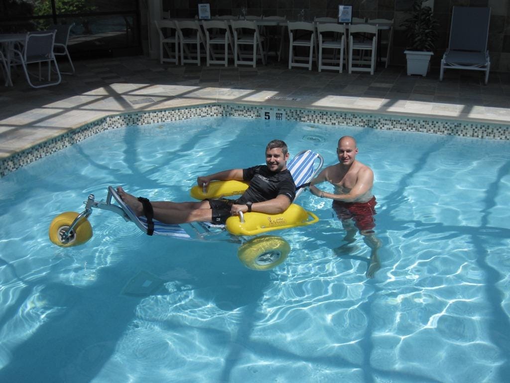 WaterWheels floating beach wheelchair in the water