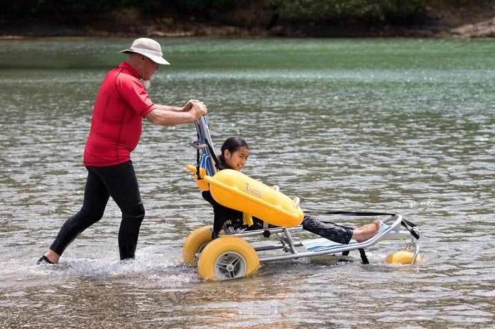 WaterWheels floating wheelchair floating in the ocean