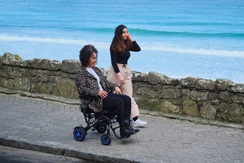Quickie Q50 R Carbon Folding Powerchair - on a walk
